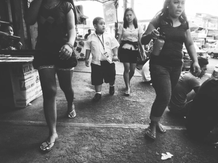 a couple of women walking down a road