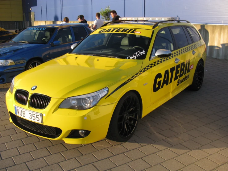 a yellow vehicle with a sign on the front