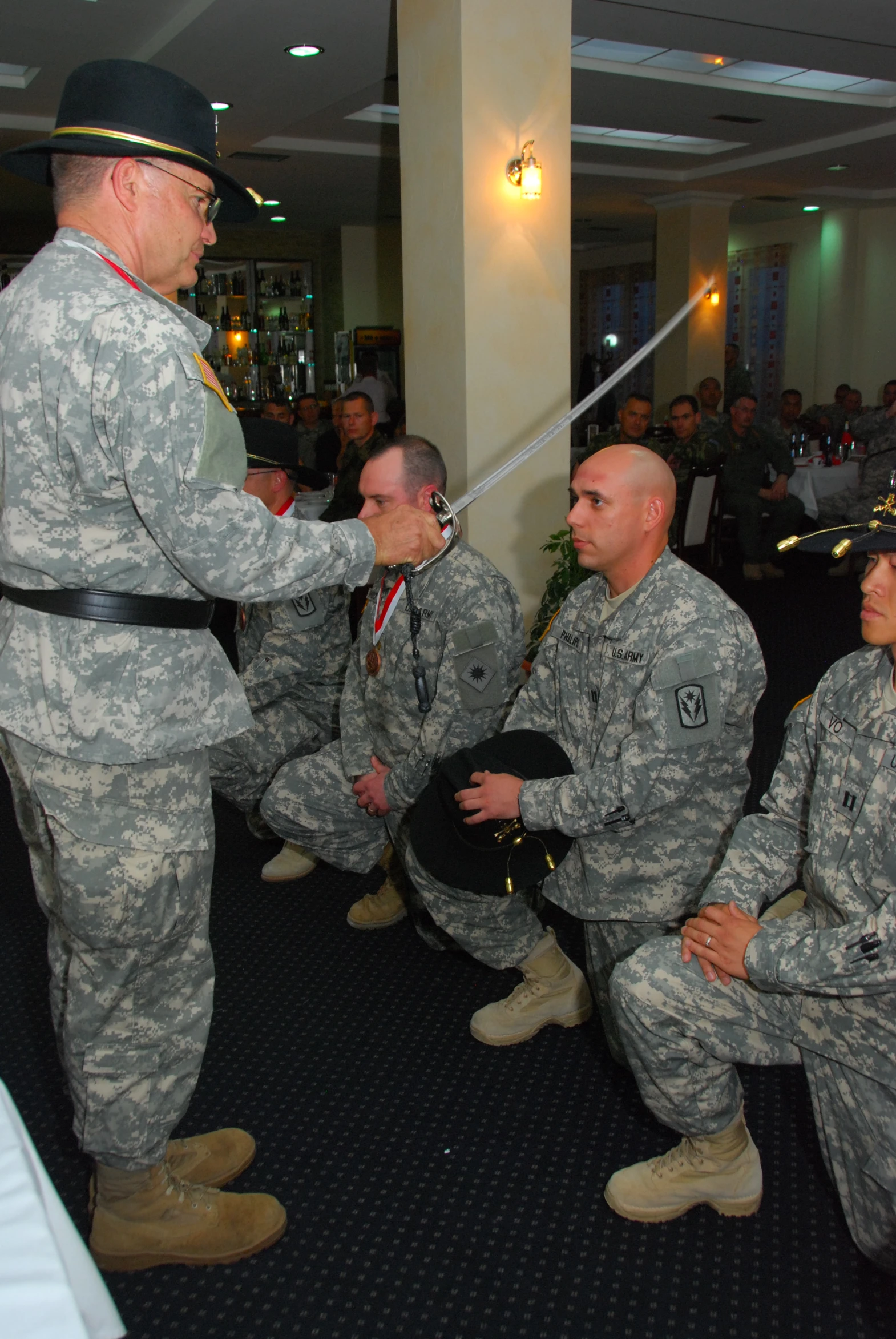 a soldier is standing next to other soldiers