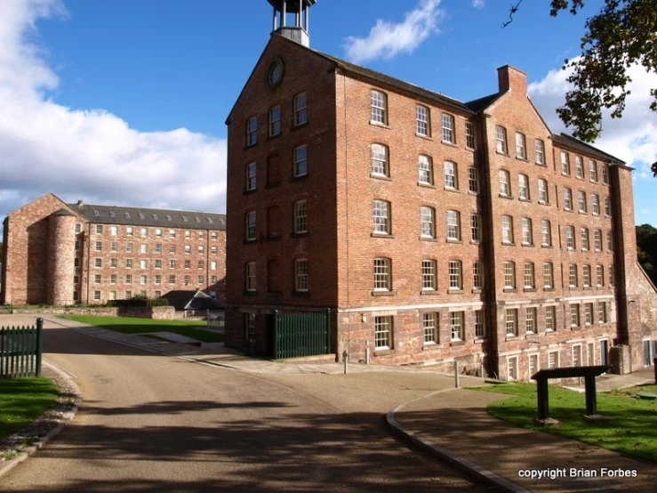 a large brick building with a clock tower at the top