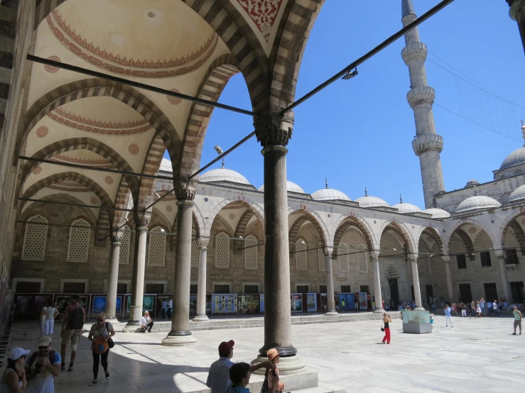 a large mosque with many people in it