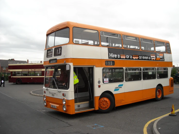 a double decker bus that is parked on the road