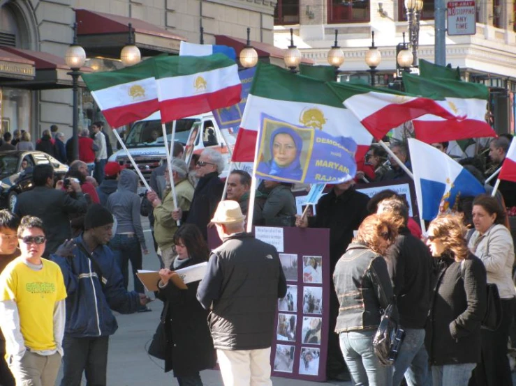 a crowd of people are protesting against israeli war games