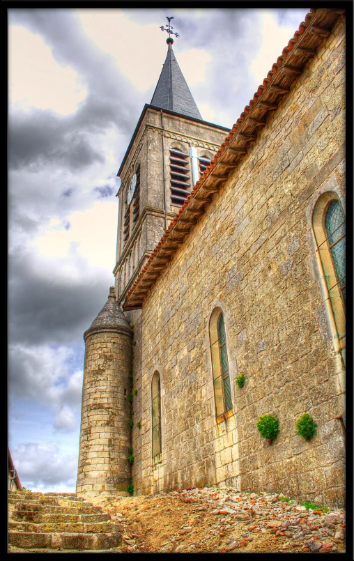 an old church has windows and a steeple