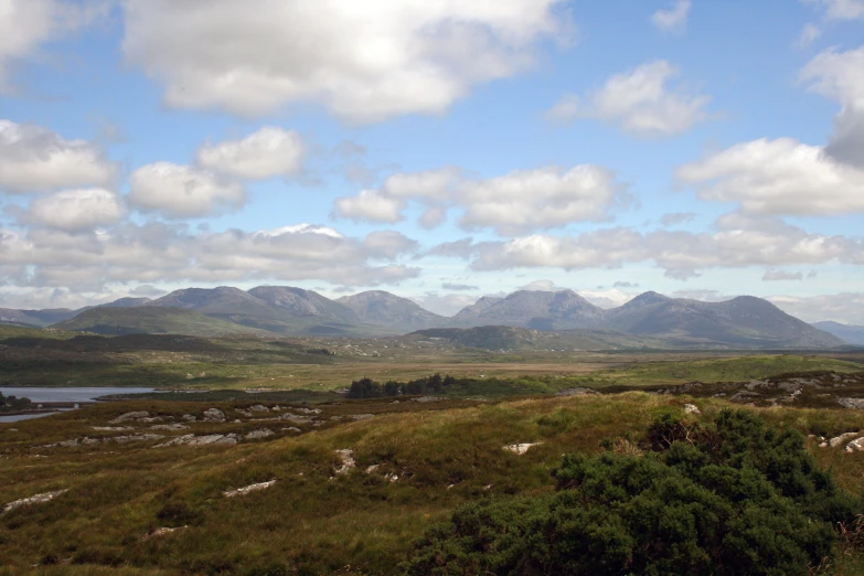 a group of mountain covered with lush green vegetation