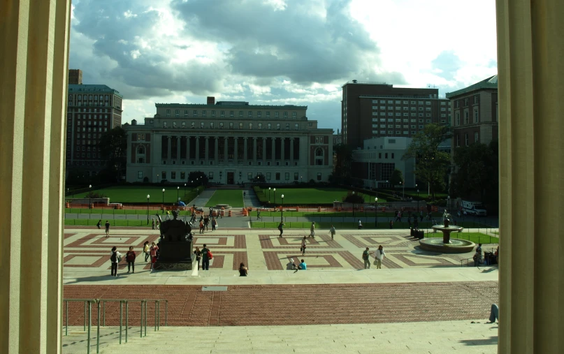 a group of people are standing outside a building