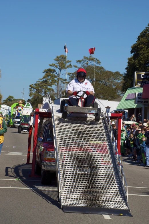 the person is on top of a giant vehicle