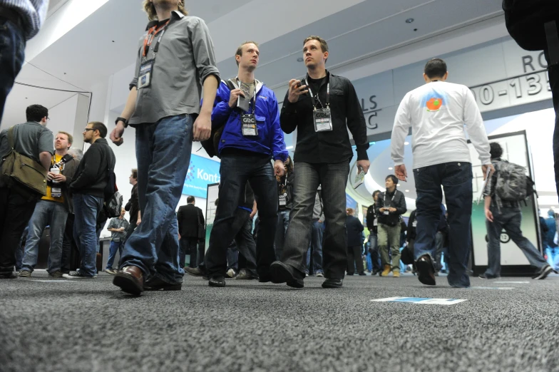 a group of young men walking through an airport