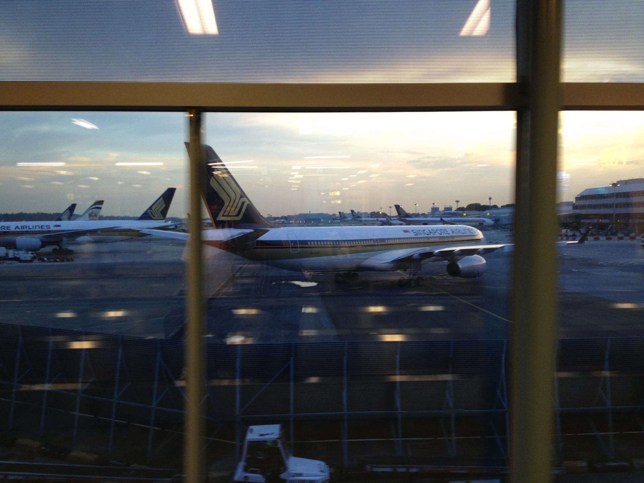 a number of airplanes near one another on a runway