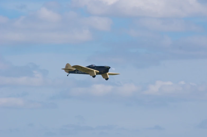 a small airplane flying high in the sky