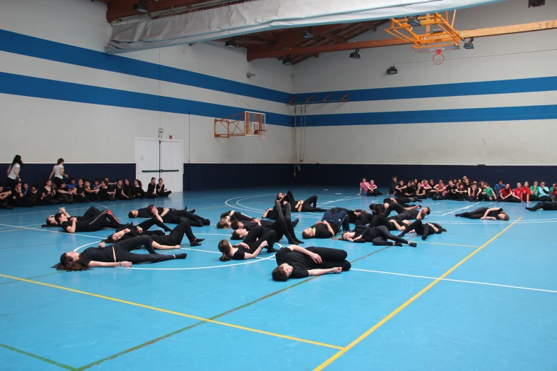 men laying on the ground on the floor