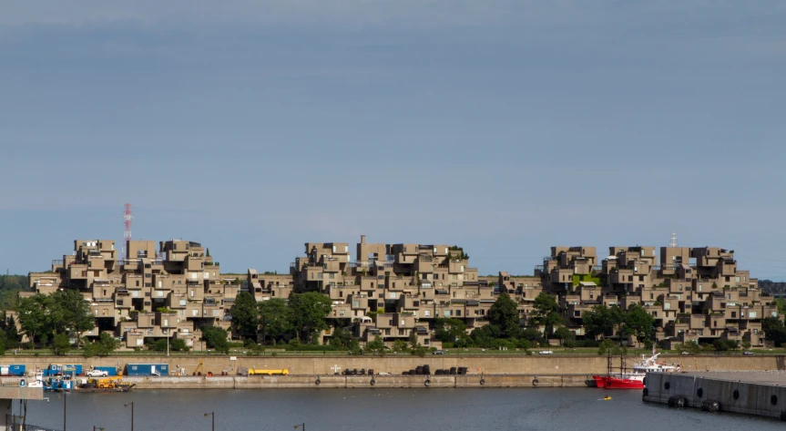 a lake in front of many identical buildings