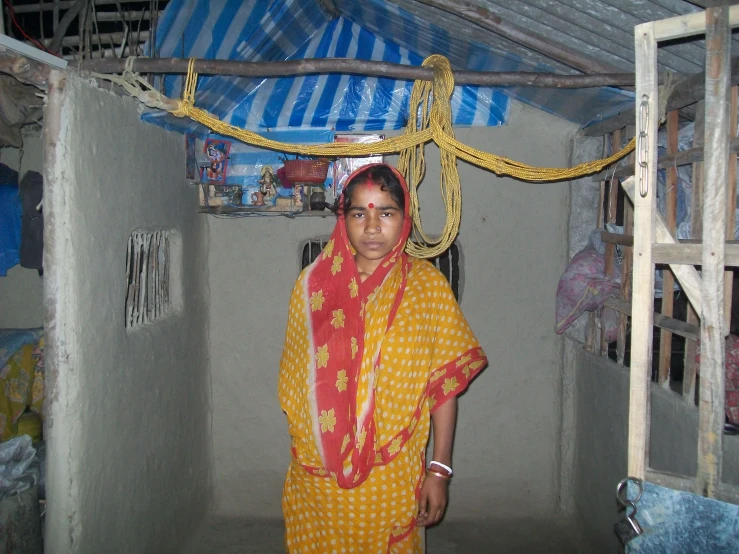 a woman is standing in a small area