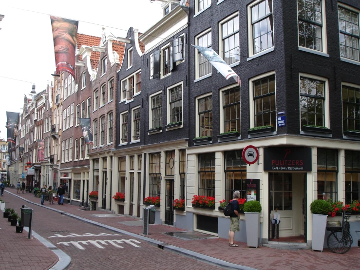 some shops on the edge of a street are empty