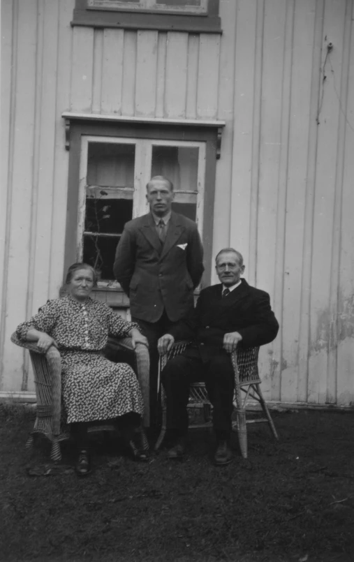 a man and a woman sitting on lawn chairs