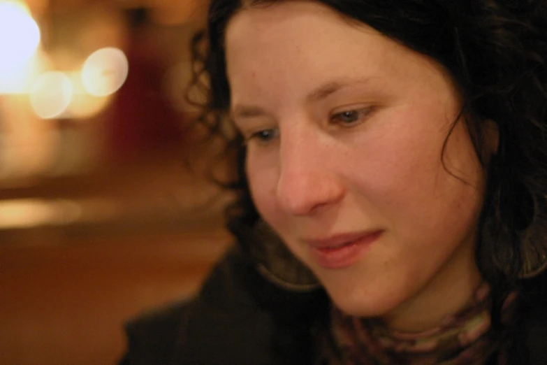 a close - up picture of the face of a woman with her eyes closed