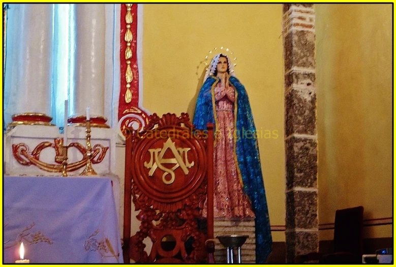 statue of virgin mary in the middle of a living room