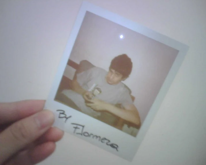 a polaroid po taken with the caption by flowers