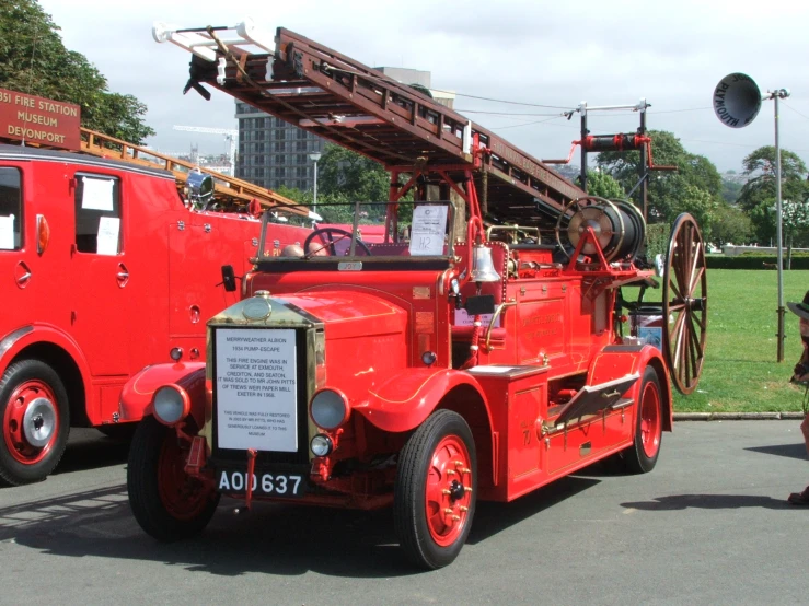 a firetruck and a red truck parked on the street