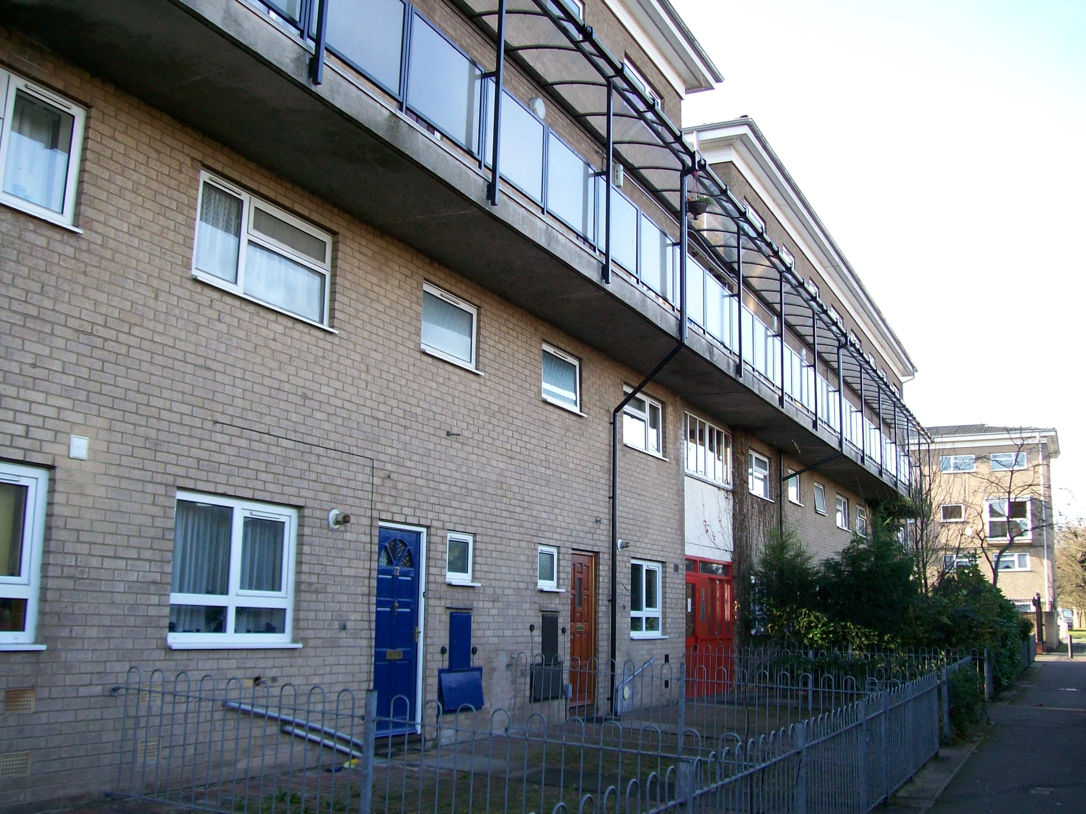 a street corner with three different types of windows