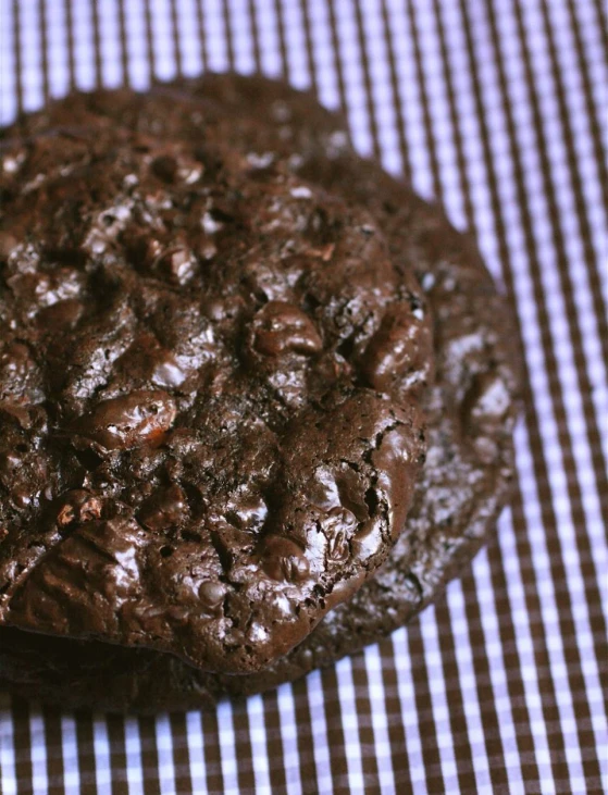 the chocolate cookie is on the checkered cloth