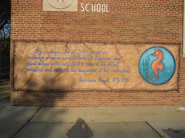 a brick wall with some writing on it