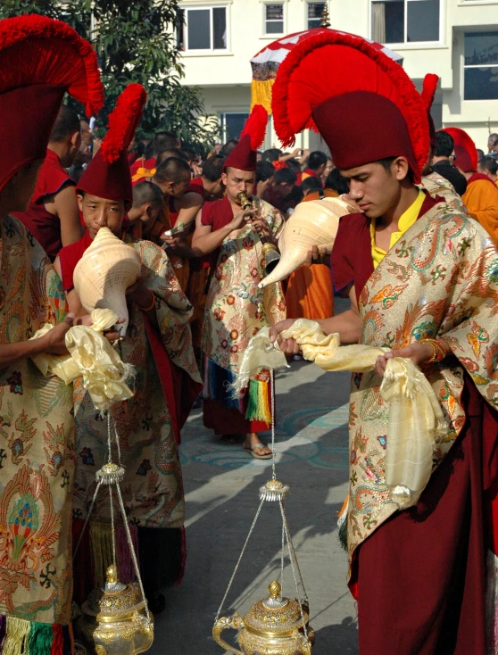 the people are dressed up like they are holding items for sale