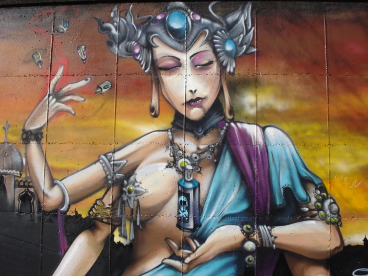 mural on the side of a wall with an indian woman