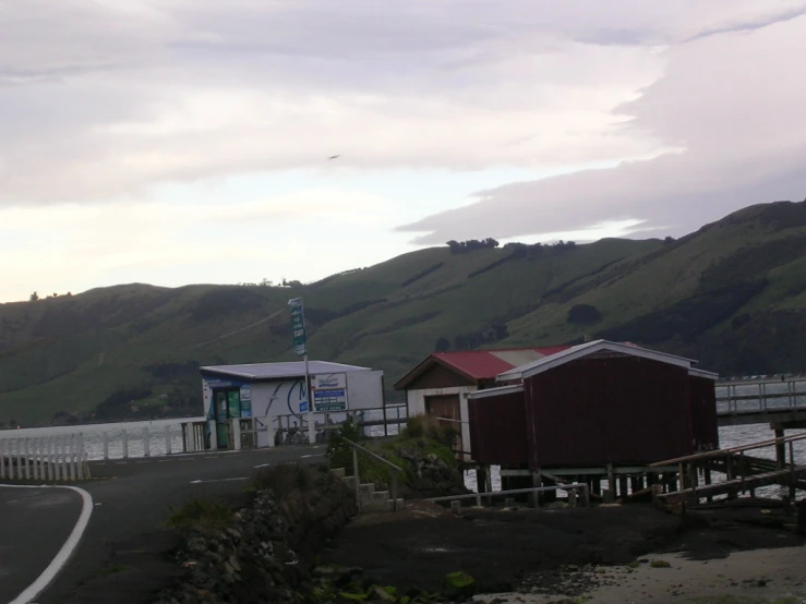 a large body of water and some small buildings