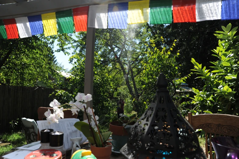 a backyard with some flowers and decorations