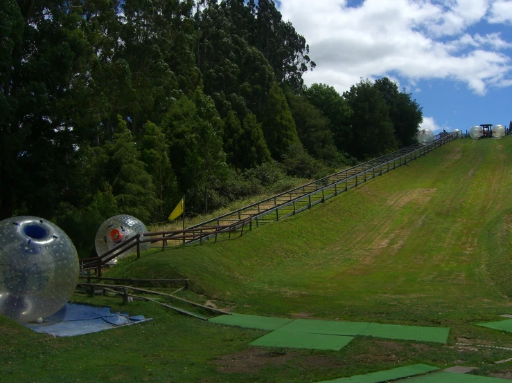 a small hill in the middle of a grassy field