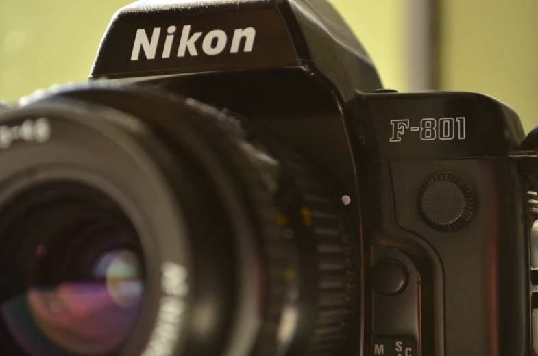 the nikon f - 100 is a compact camera with 28mp lens