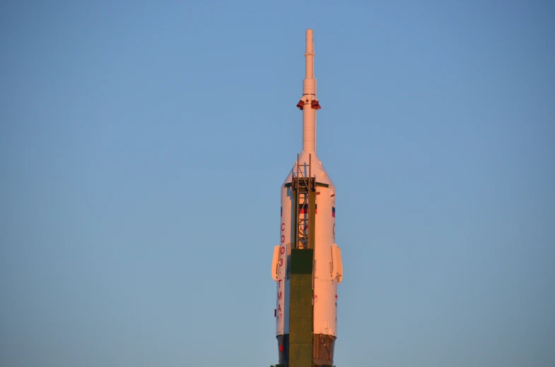 a large space shuttle sits atop the building