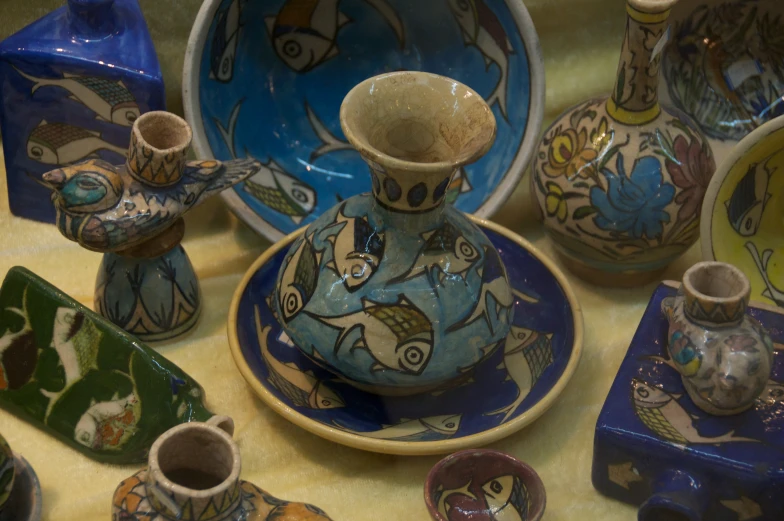several plates and cups are being displayed together