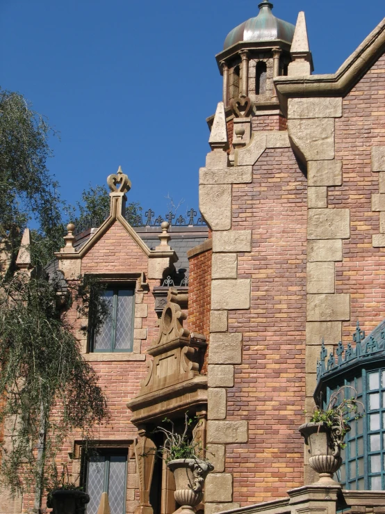 a stone building with a clock on the outside