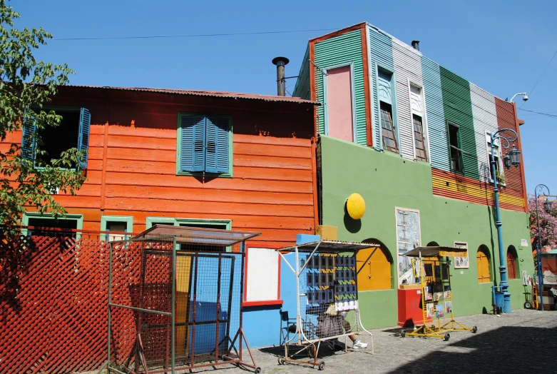 there is a large multi colored building with several windows