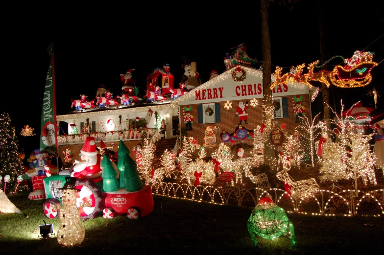 a small house is illuminated with christmas lights