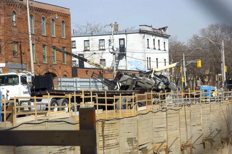 the truck is carrying a trailer in the back