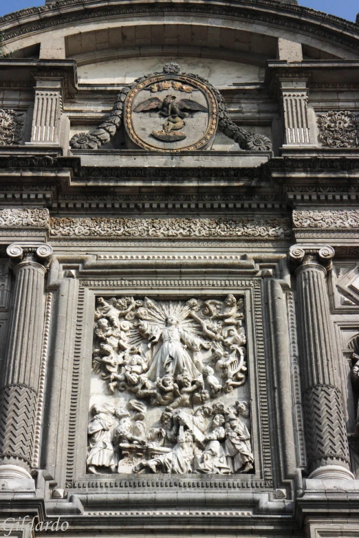 a large clock on the side of a very tall building