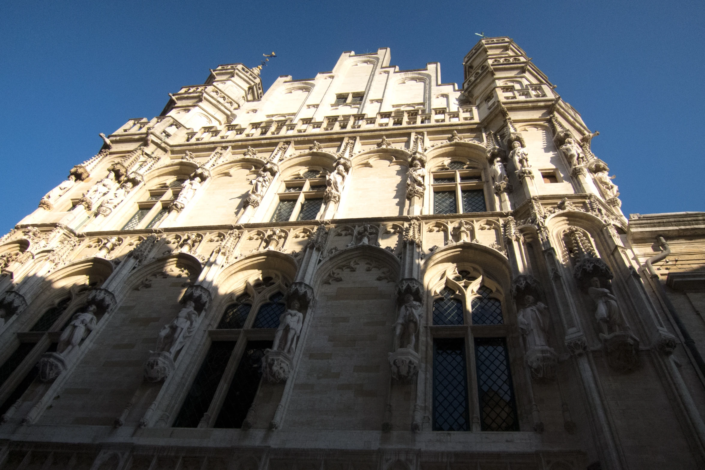 a tall building with several windows and arched design