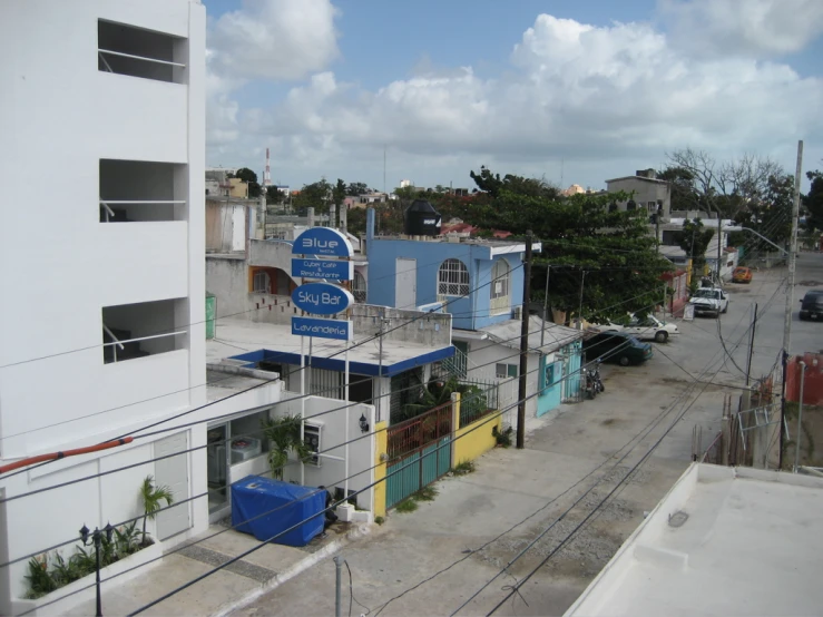 a group of buildings with signs on the side