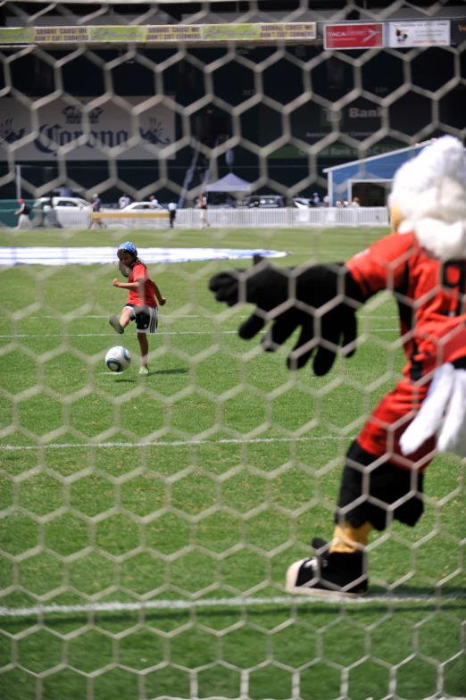 a child's soccer game is being played by two adults