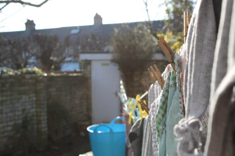 a bunch of cloths hang on some clothes line