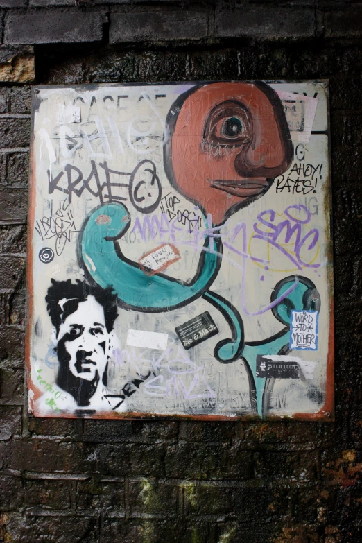 graffiti on a wall with an old head wearing a stencil