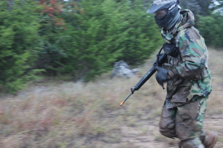 a soldier with a rifle in his hand