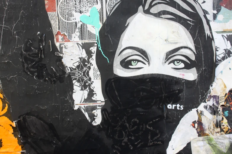 graffiti of a woman wearing a black bandana