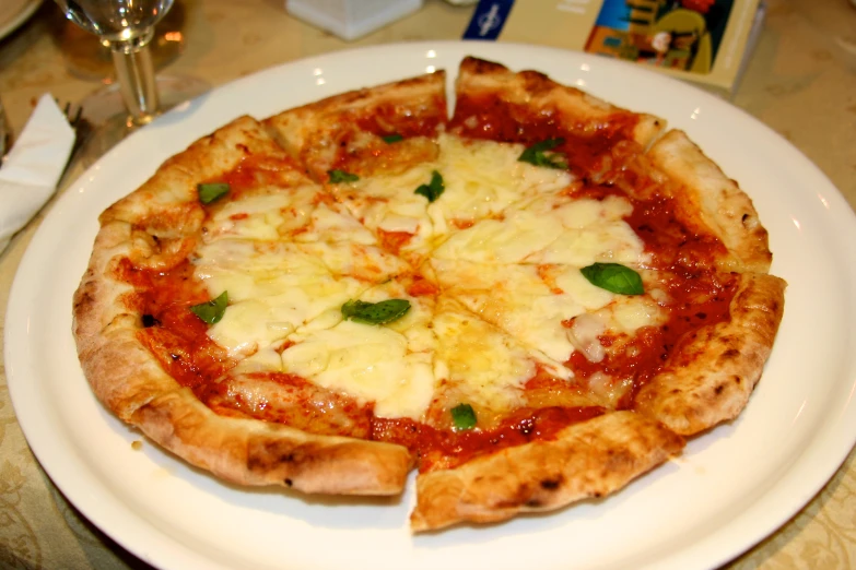 a pizza sitting on top of a white plate