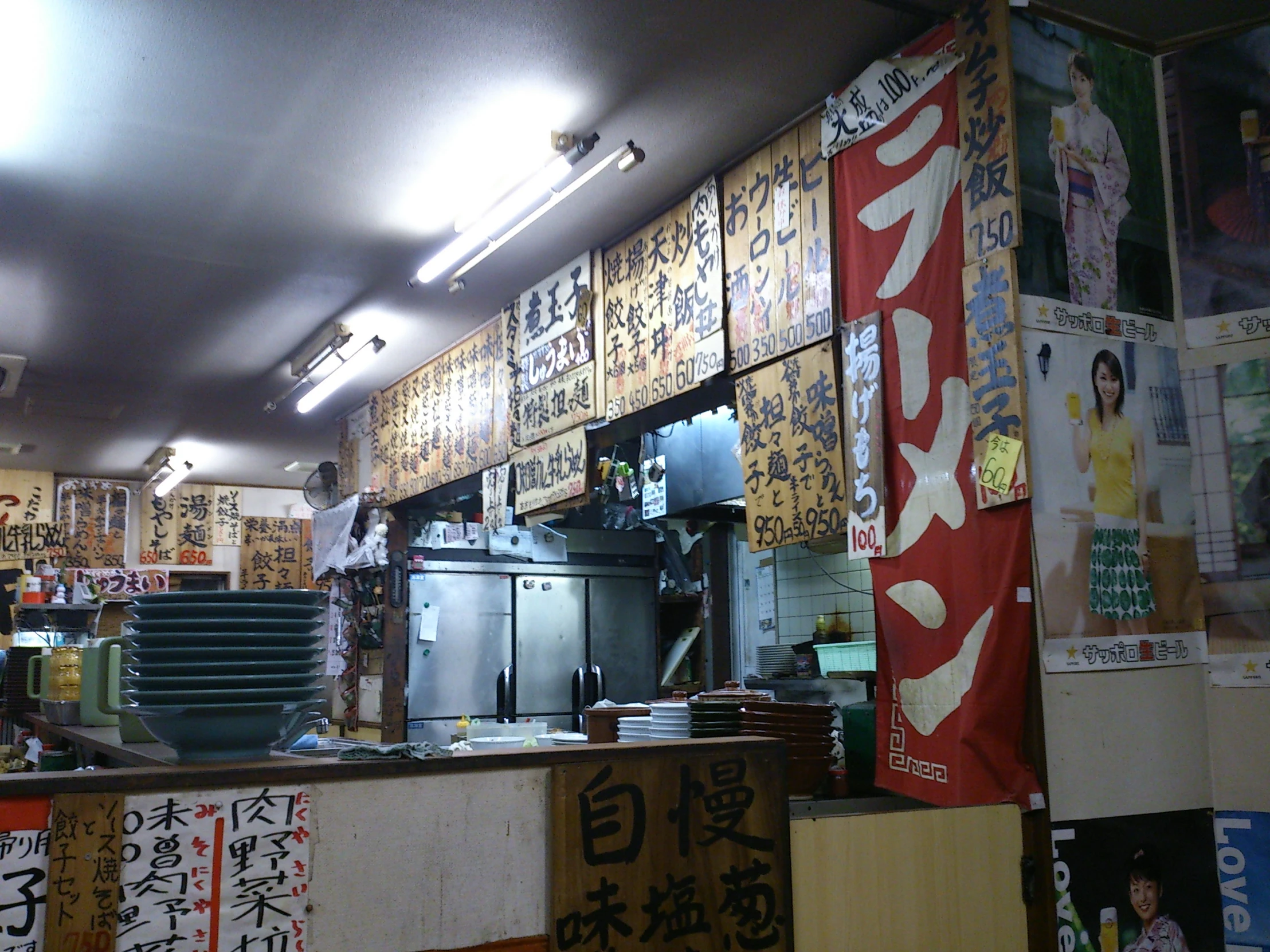 an oriental restaurant with japanese signs hung on the walls