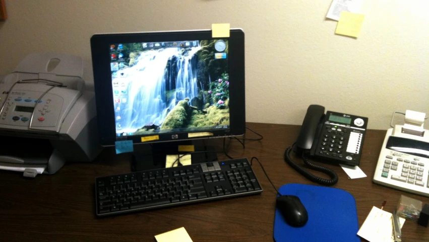 a desktop computer monitor sitting next to a keyboard