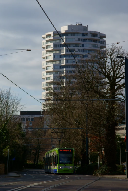 a bus on the street in front of a building